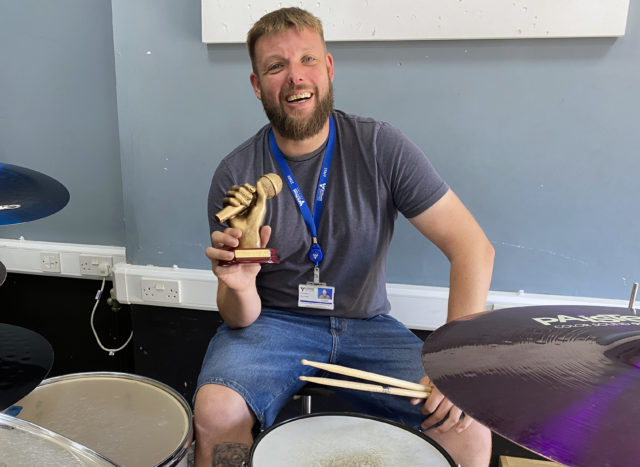 St Vincent College Head of Music Chris Harris with the Solent Sound trophy in one of his department’s rehearsal rooms